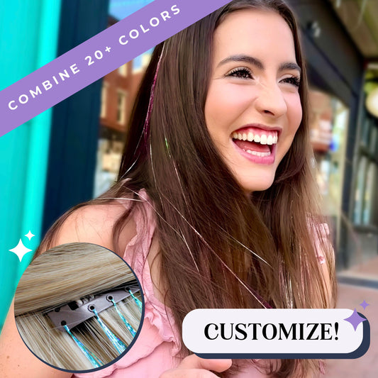 Pink and holographic white color clip in tinsel hair shown on brunette hair.  reusable and easy to use fairy hair clip in accessories for kids. Happy woman with tinsel hair.  Happy girl with fairy hair. Happy teen with college spirit.